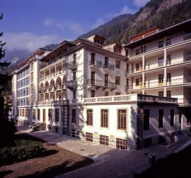 The Vallesana Centre, a Liberty-style building surrounded by mountain sceneries